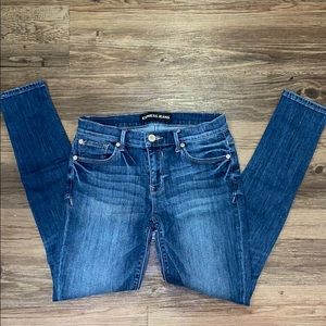 Express medium wash mid rise skinny jeans